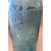 Spuitfles van turquoise glas